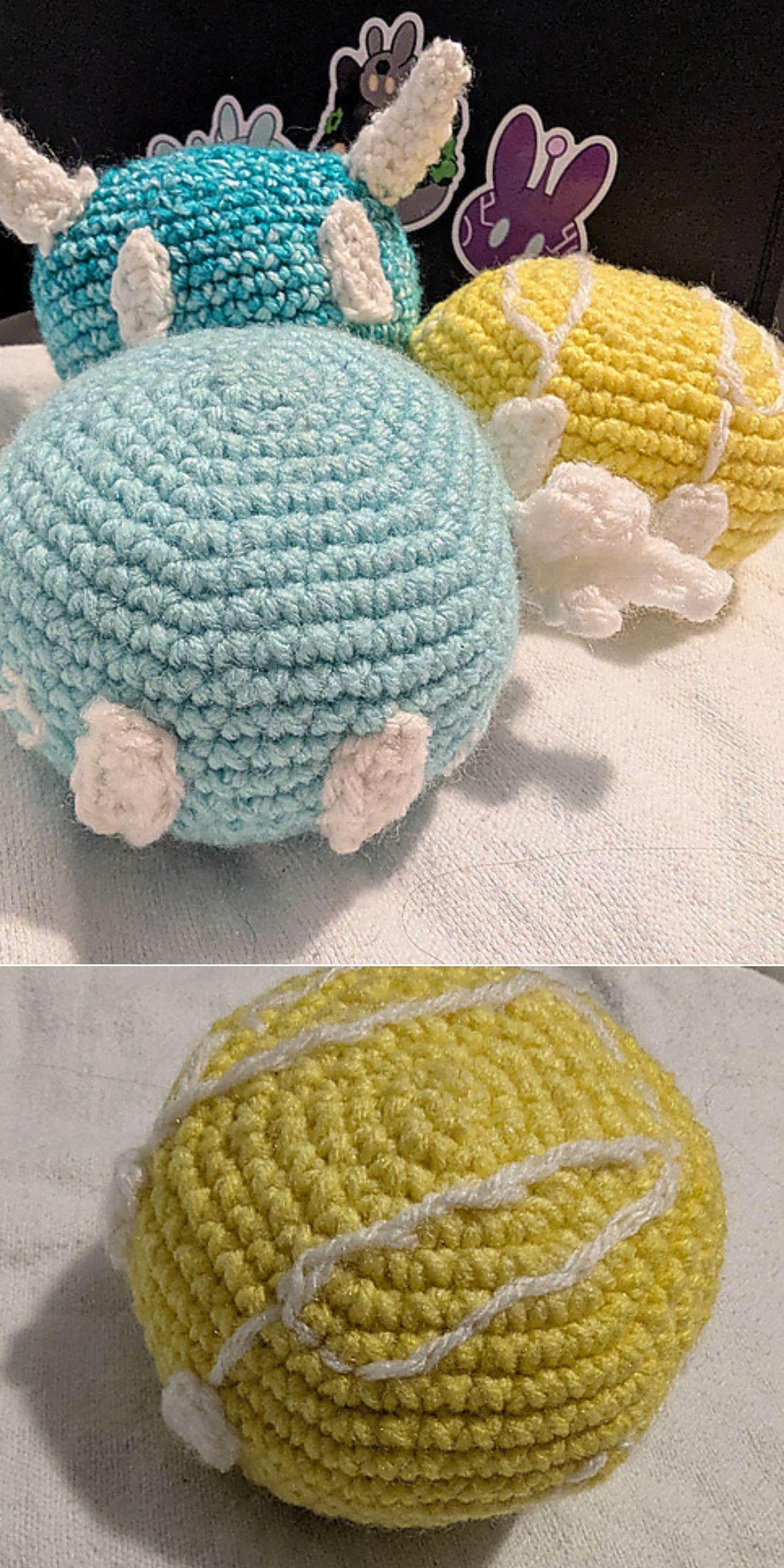 Two crochet baby toys, one blue with white details and one yellow with white lines, are displayed on a surface, with a close-up of the yellow plush below.