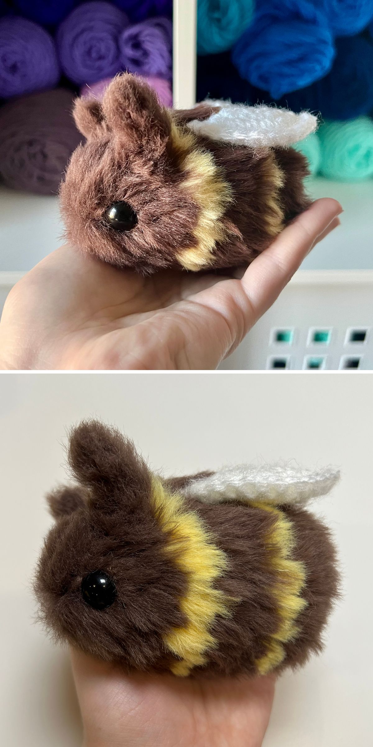 A hand holds a small crochet bee amigurumi, plush and brown with yellow stripes, black eyes, and white wings. In the background, colorful yarn adds a playful touch.
