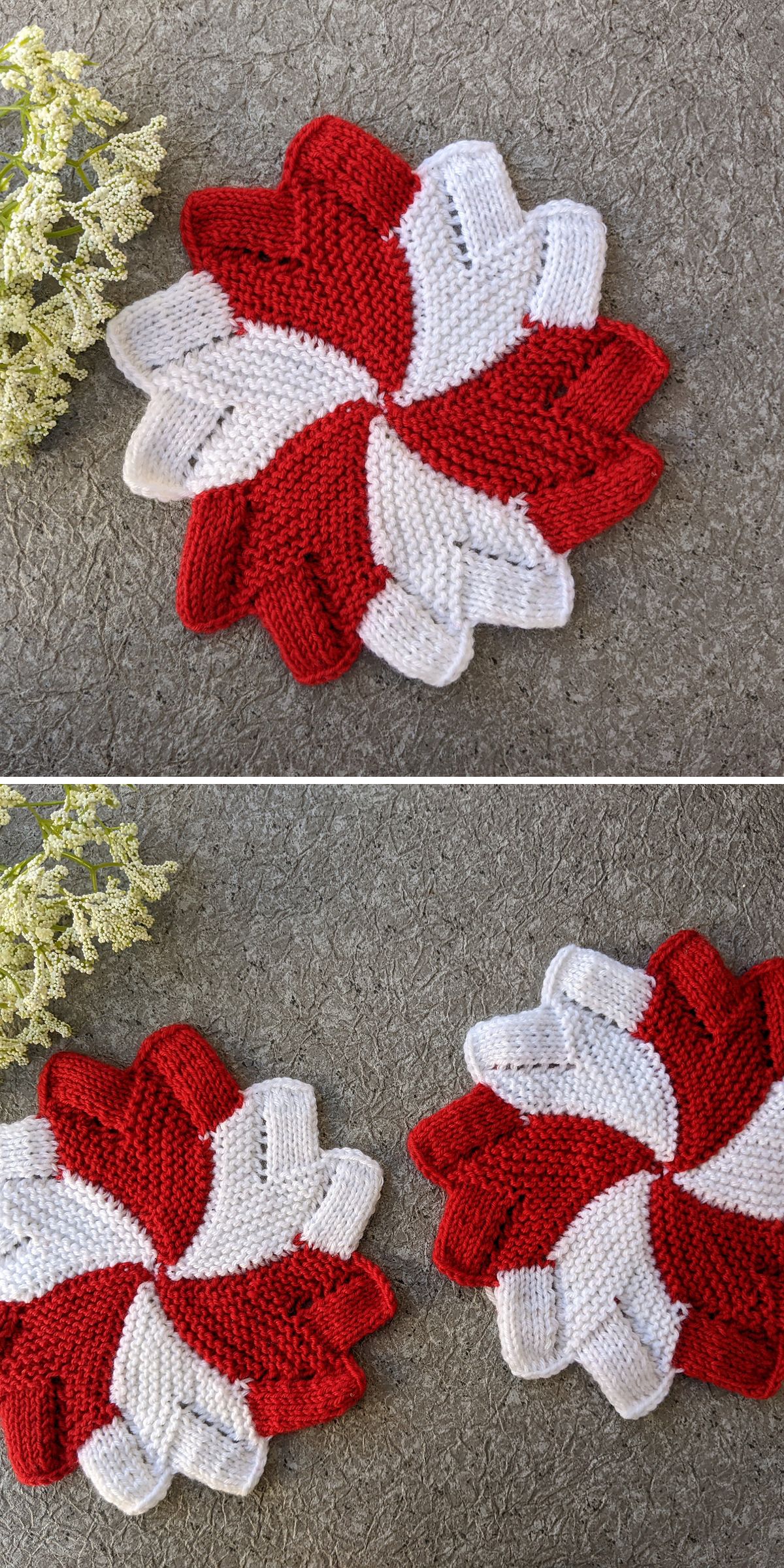 Two knitted coasters with red and white spiral patterns are placed on a gray textured surface next to small white flowers.