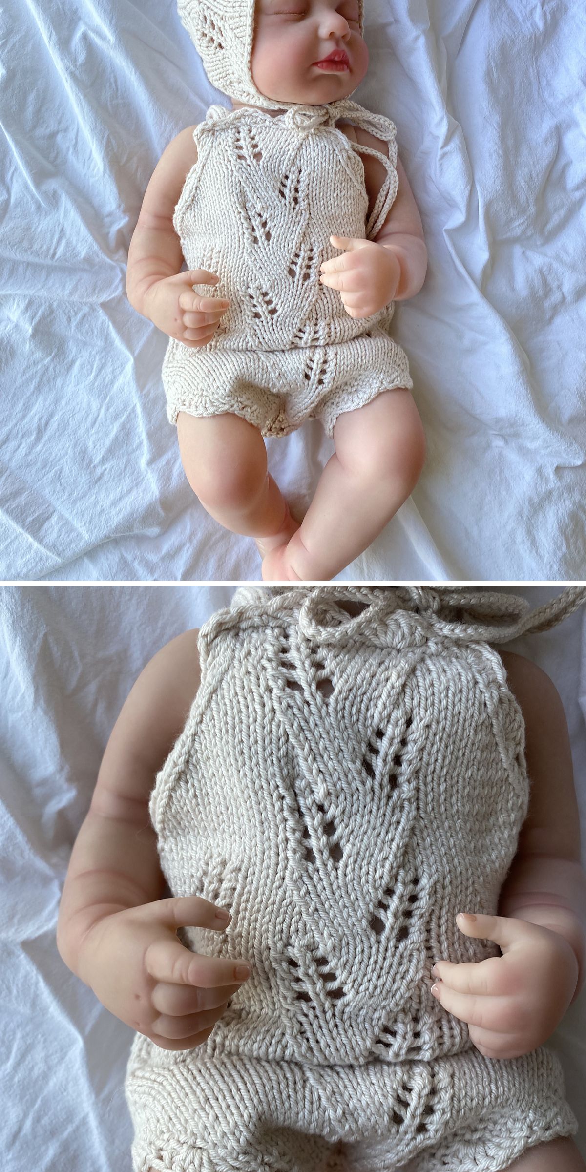 A realistic doll wearing knitted kids clothes — a cream-colored bonnet and romper with a delicate lace pattern — lies on a white fabric surface.
