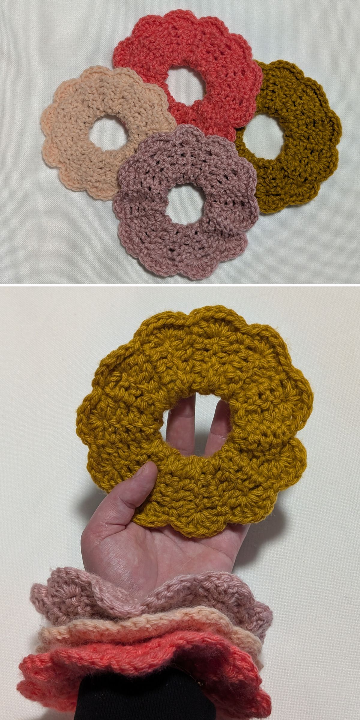 Four crochet scrunchie flower-shaped accessories in pink, beige, brown, and yellow are shown; one yellow scrunchie is held in a hand while the others are worn on the wrist.