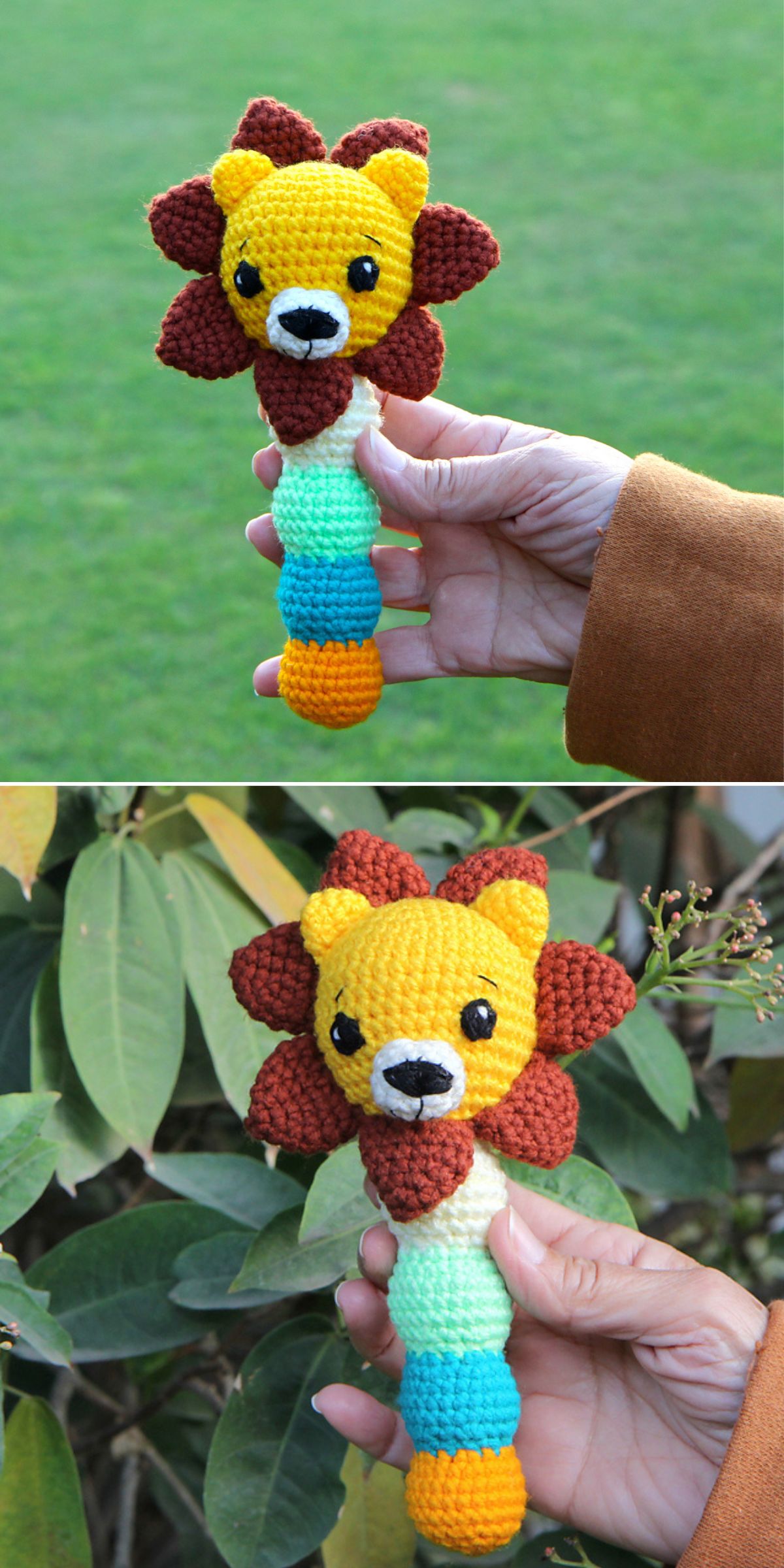 A hand holds a charming crochet baby toy — a lion rattle with a yellow face, brown mane, and multicolored handle; grass and foliage form the backdrop.
