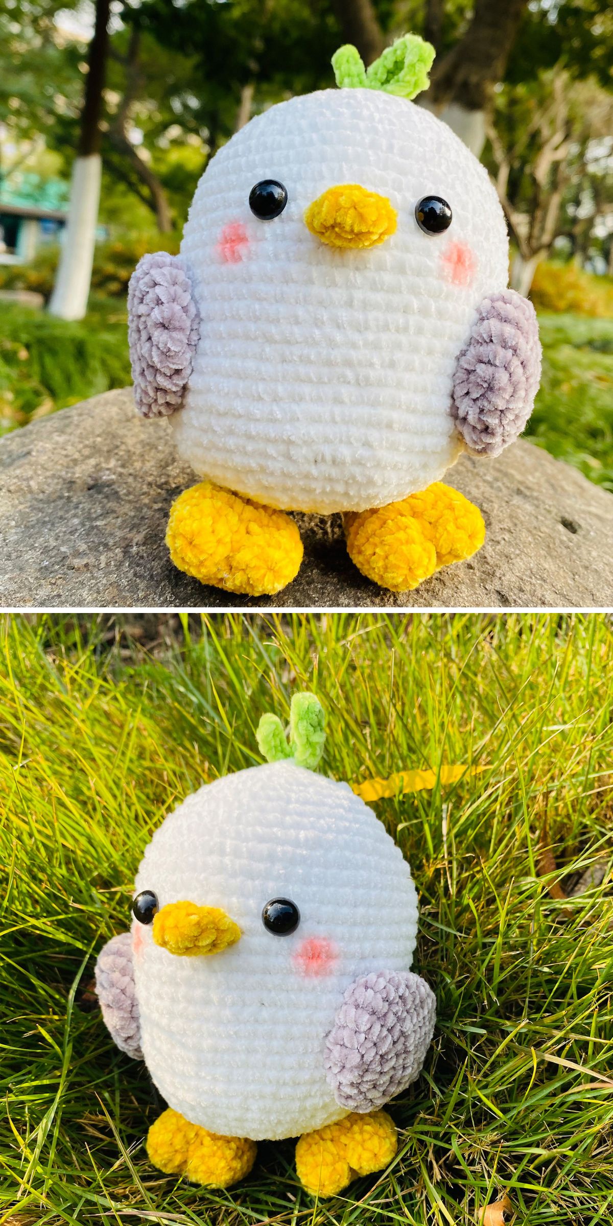 A round crochet bird plush with yellow feet and beak, gray wings, black eyes, a green tuft on its head, and pink cheeks, shown outdoors perched on a rock and nestled in the grass.