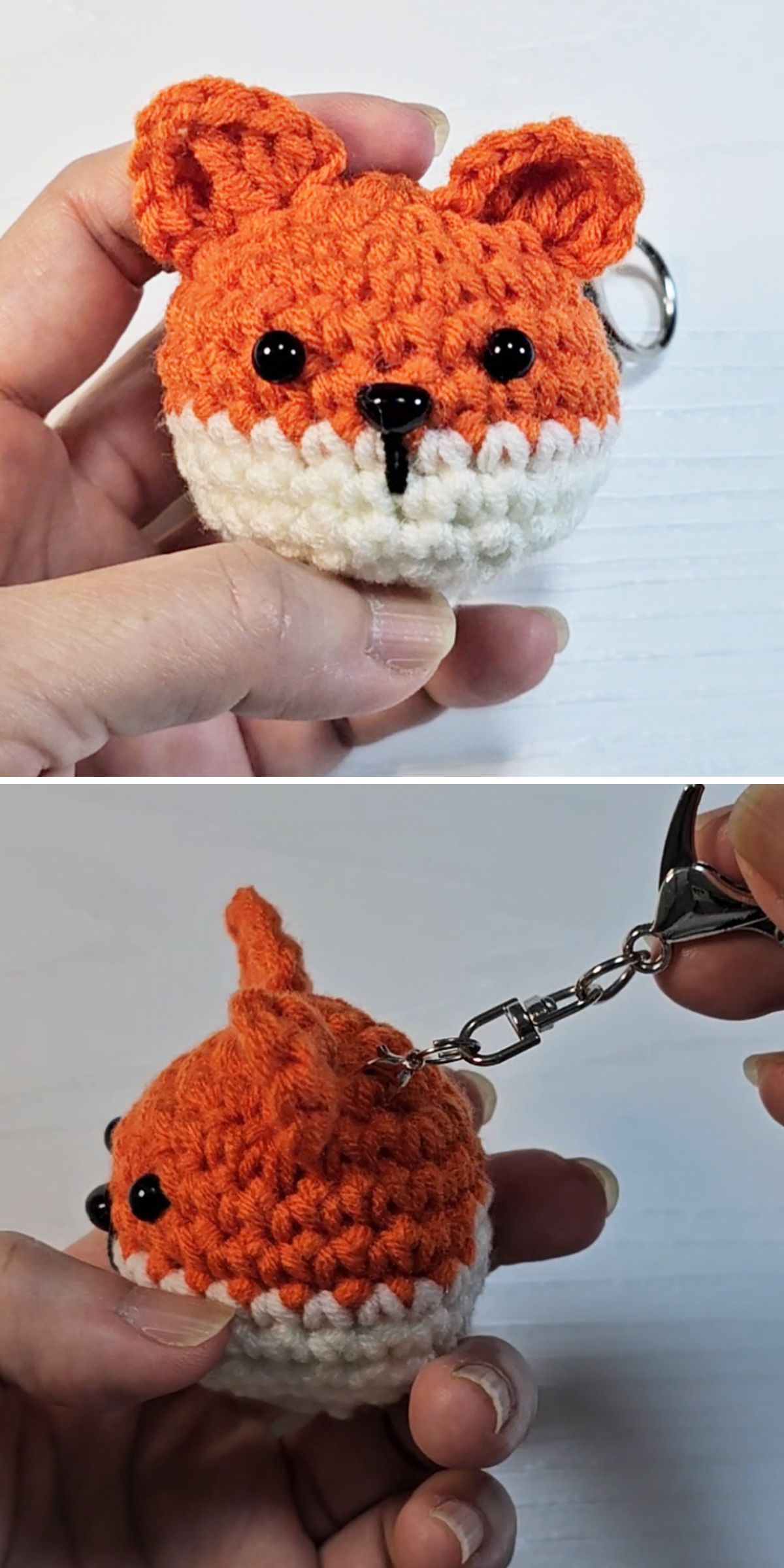 A hand holds a crochet fox head keychain while another hand attaches a metal key ring to the cute accessory.