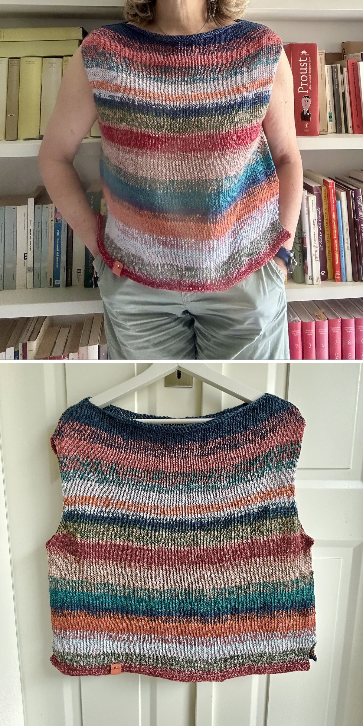 a woman in striped knitted top and grey pants, standing in front of the book shelf