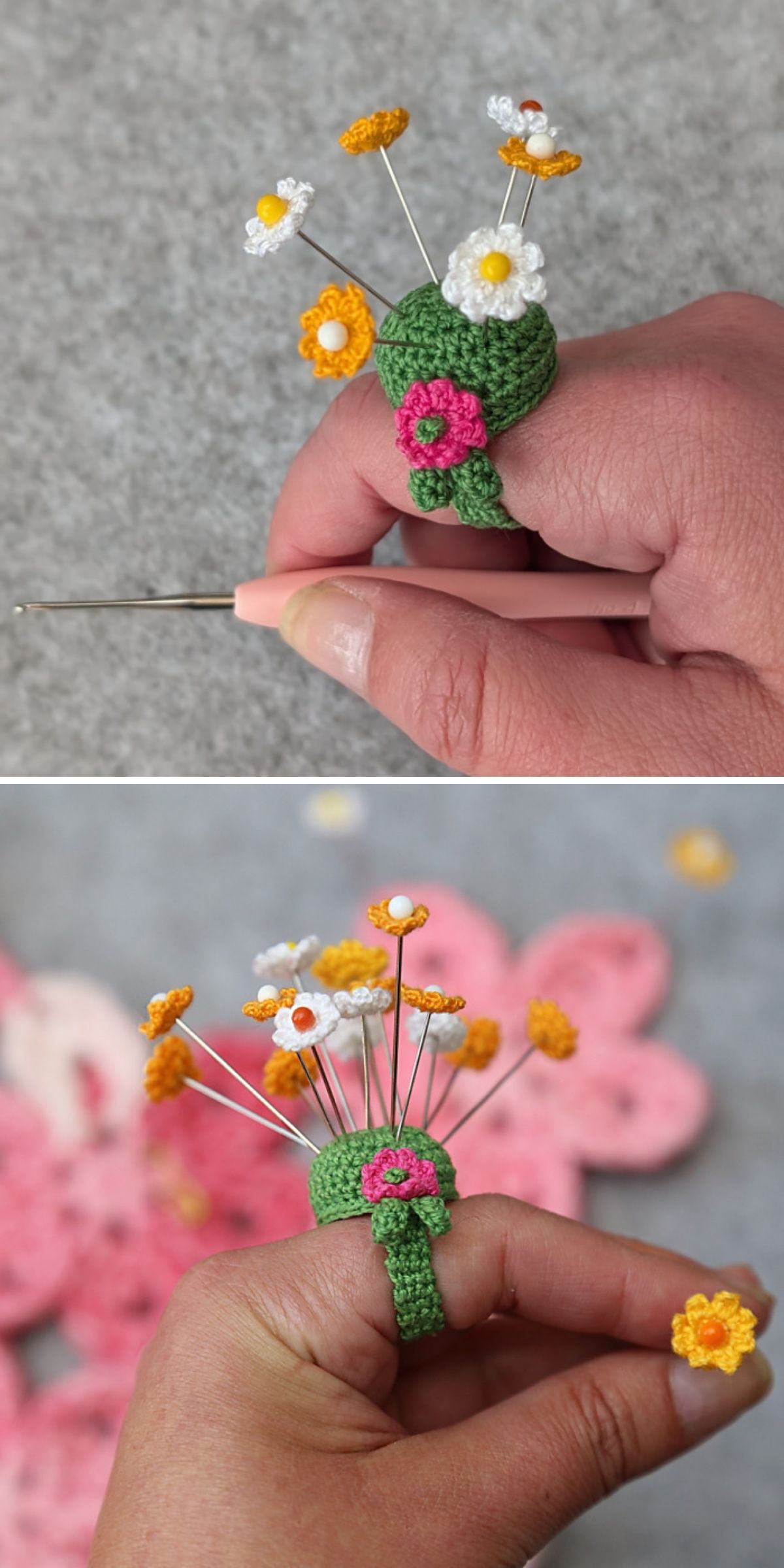 A hand wearing a green crocheted ring shaped like a flower bouquet, reminiscent of a delicate crochet pincushion, with small yellow and white flowers attached to wire stems.
