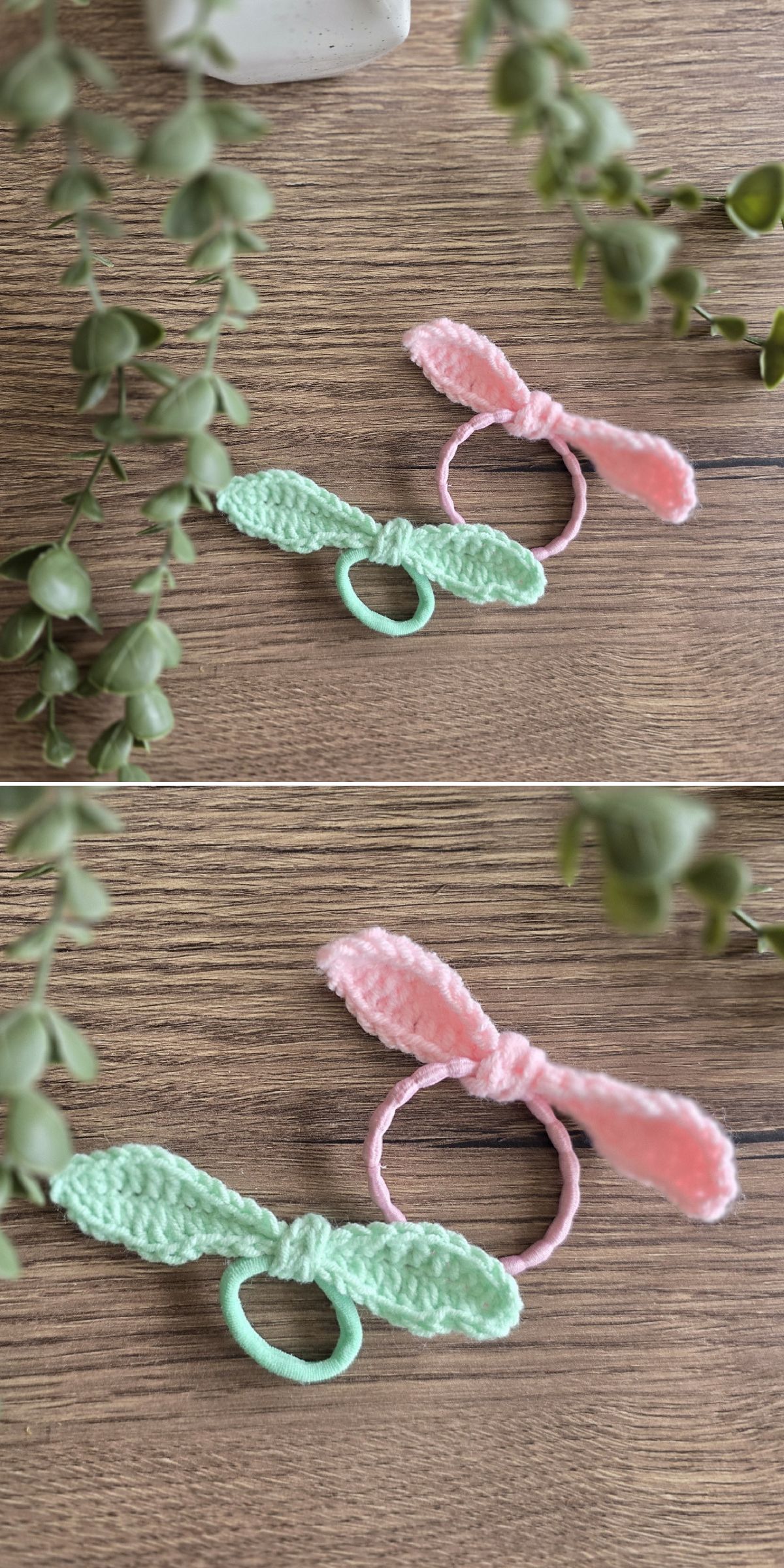 Two handmade hair ties with crochet bunny ear designs, one pink and one green, are displayed on a wooden surface next to trailing green plants—each charming crochet scrunchie adds a playful touch to your hairstyle.