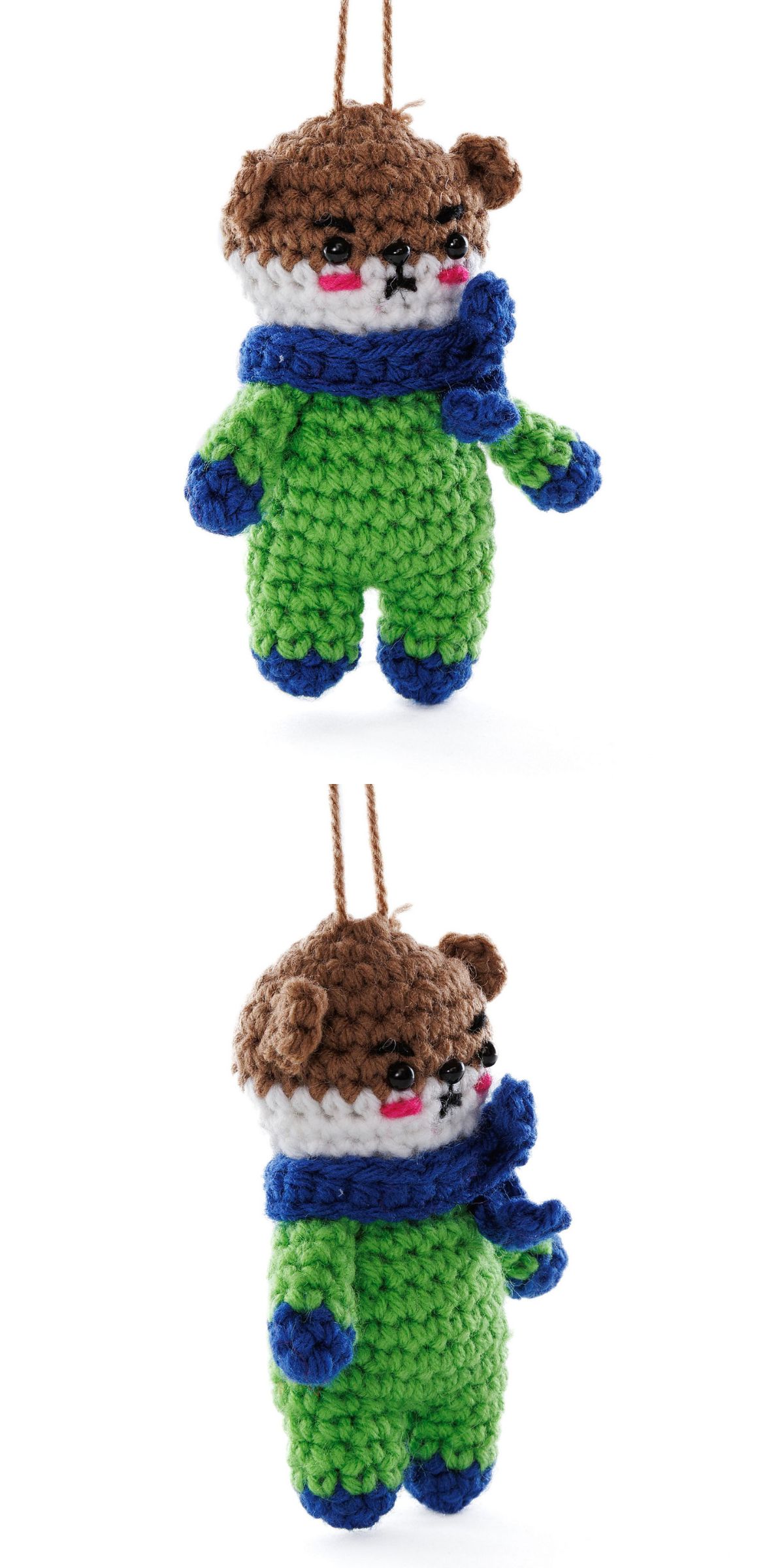 a crochet otter ornament with a body worn in a green onesie and dark blue scarf, mitts, and boots