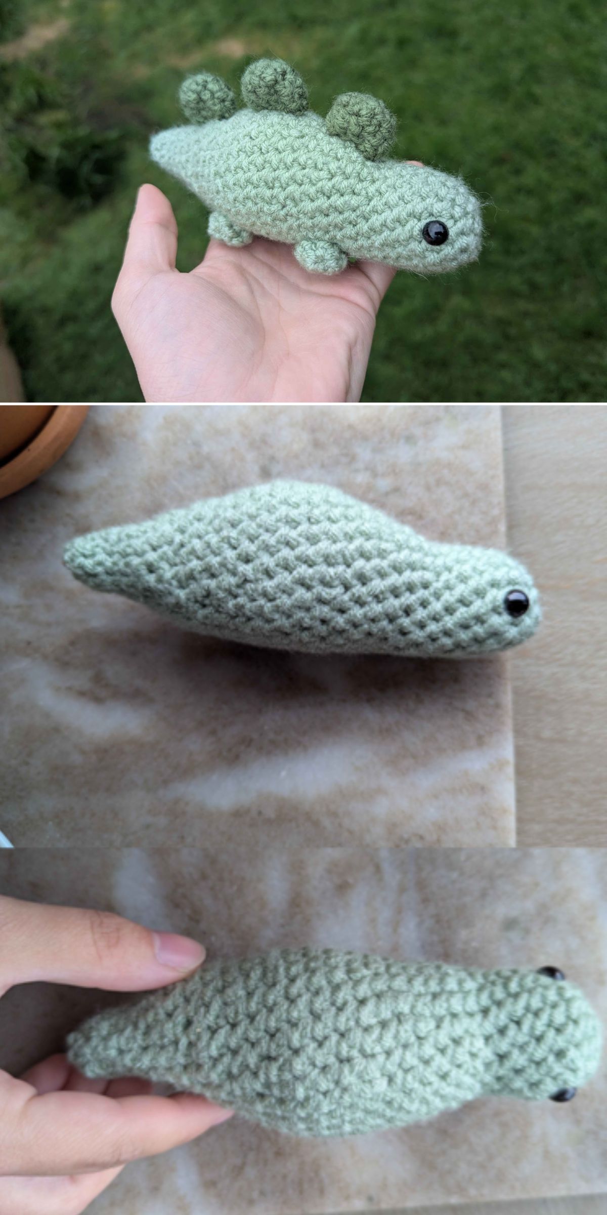 a hand holds a tiny, lovely, crochet stegosaurus in a pale green color