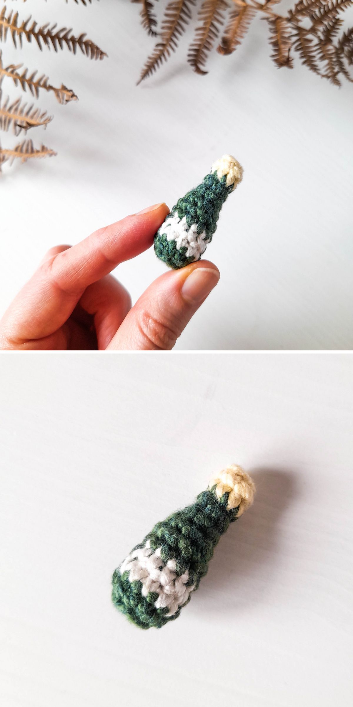 A hand holds a small, crocheted wine bottle, crafted with green, white, and yellow yarn — perfect for adding charm to your crochet drink patterns. The second image shows the same object resting on a white surface.