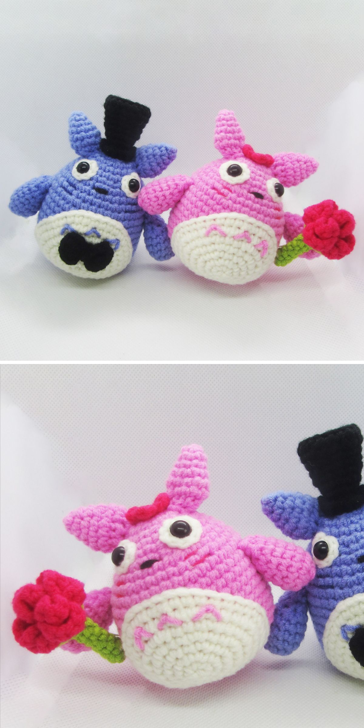 Two crochet Totoro plush toys, one blue with a top hat and mustache, and one pink with a bow holding a red flower, are positioned against a plain white background.