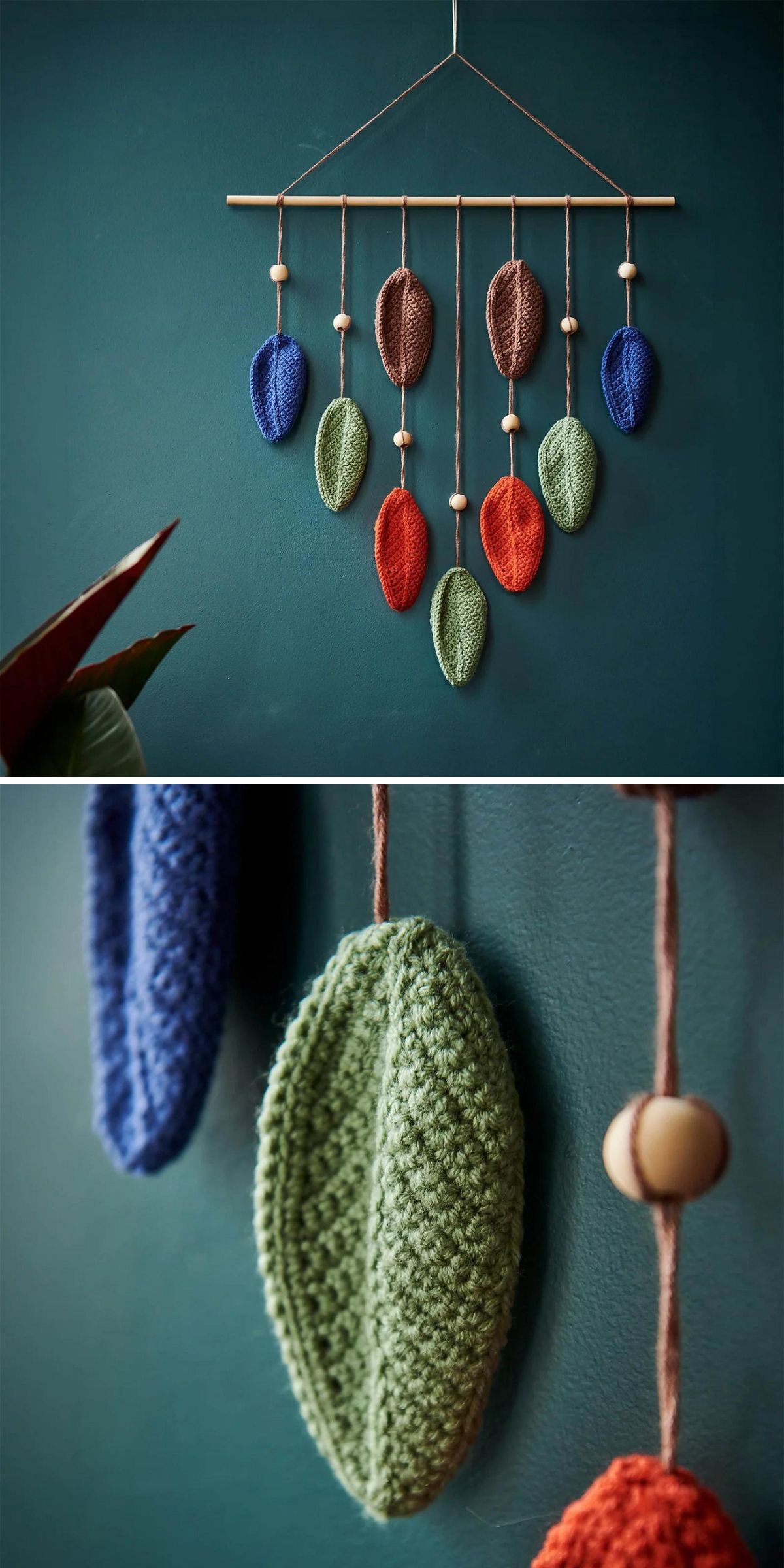 A handmade wall hanging with crocheted leaves in blue, brown, orange, and green, suspended from a wooden rod alongside wooden beads against a teal wall—perfect for adding unique home decor inspired by crochet wall hanging patterns.