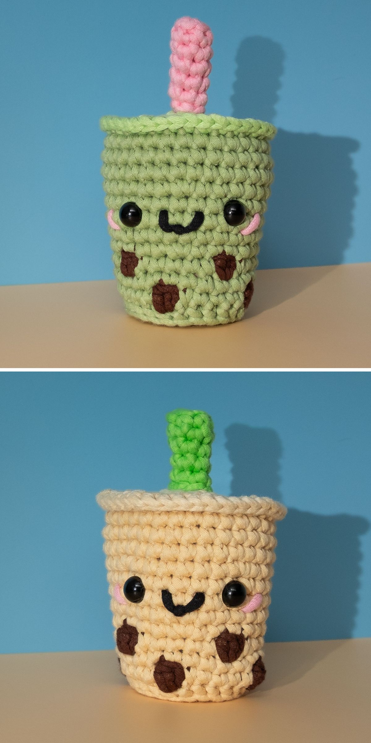 Two crocheted boba tea plush toys with smiling faces, black eyes, and brown "tapioca pearls," one green with a pink straw and one beige with a green straw, are perfect inspiration for crochet drink patterns against a blue background.