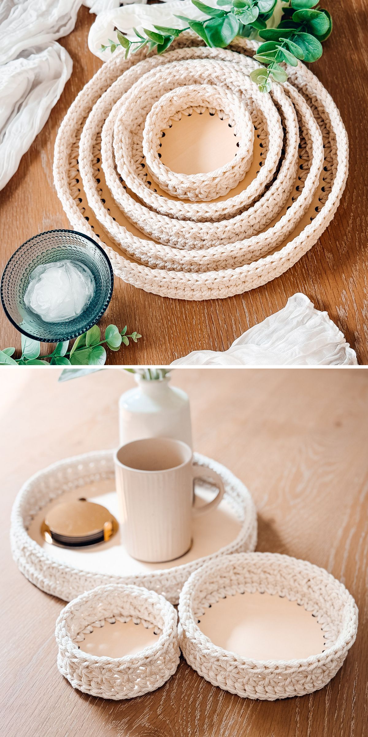 A set of round woven trays and a crochet basket in various sizes are arranged on a wooden table, surrounded by decorative items and greenery.