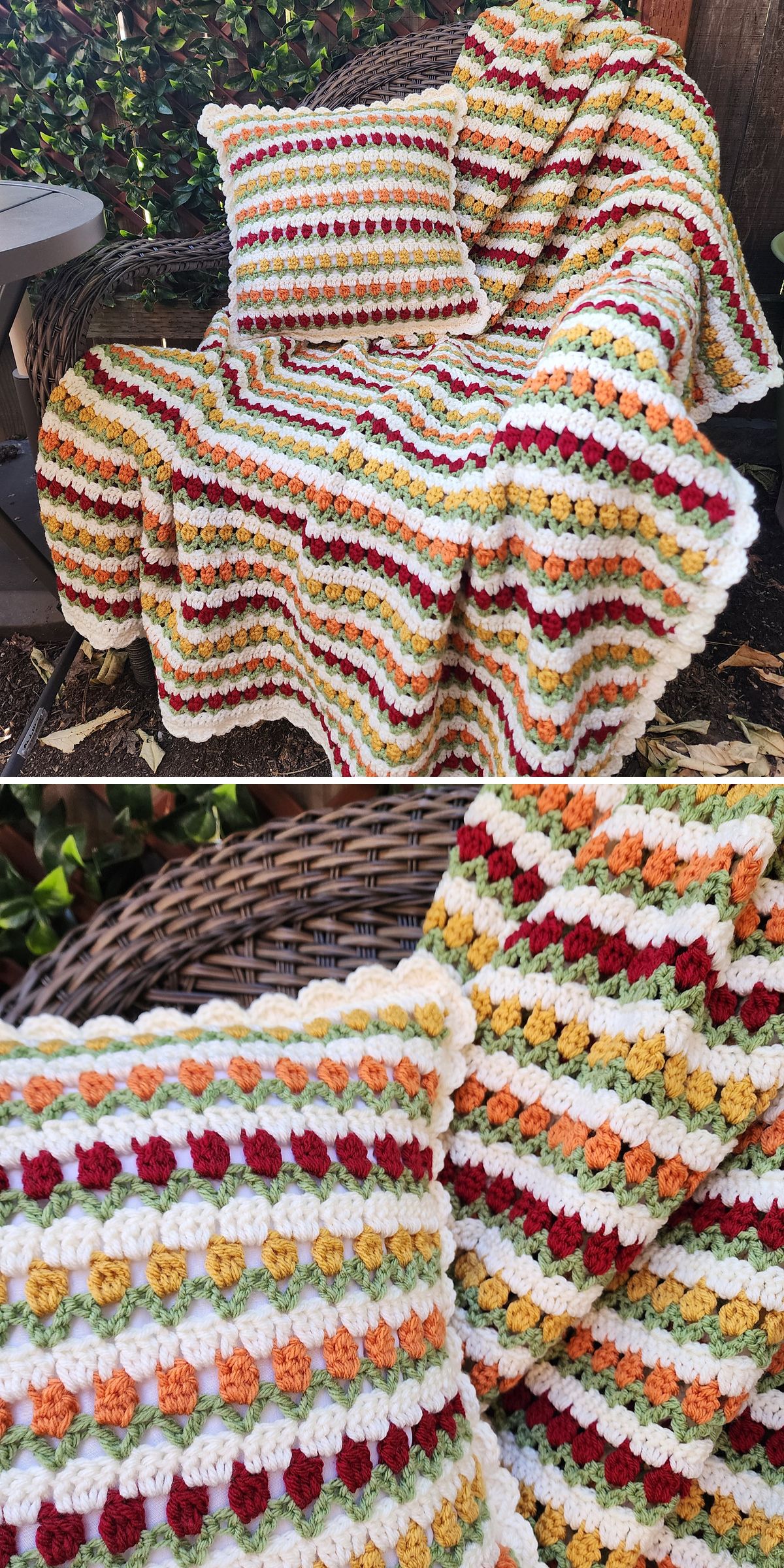 A crochet flower blanket and matching pillow with rows of textured stitches in fall colors, draped over a wicker chair outdoors.