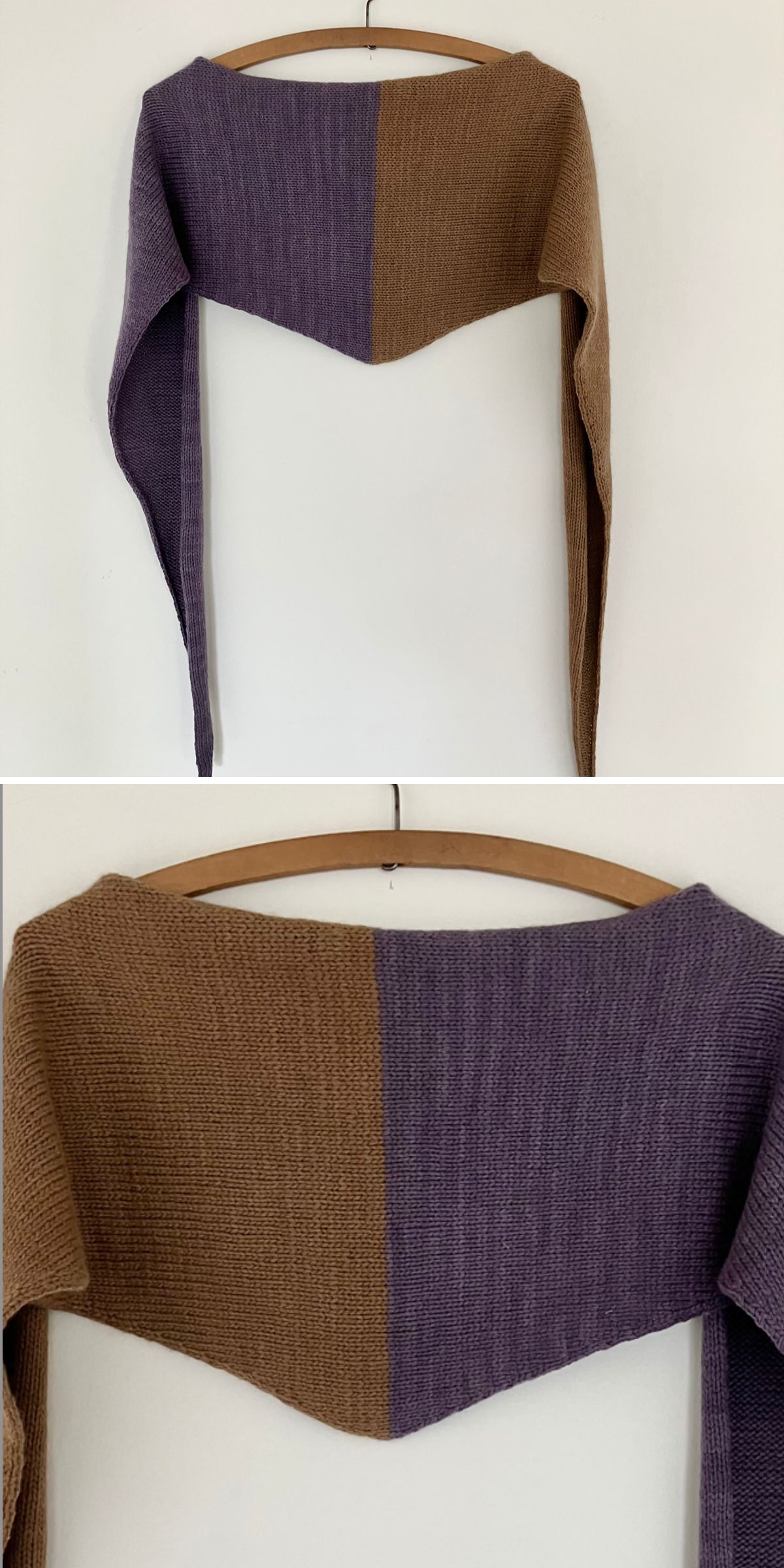 A knit shawl in two colors — brown on the left, purple on the right — hangs on a wooden hanger against a white wall. The fabric forms a symmetrical V shape.