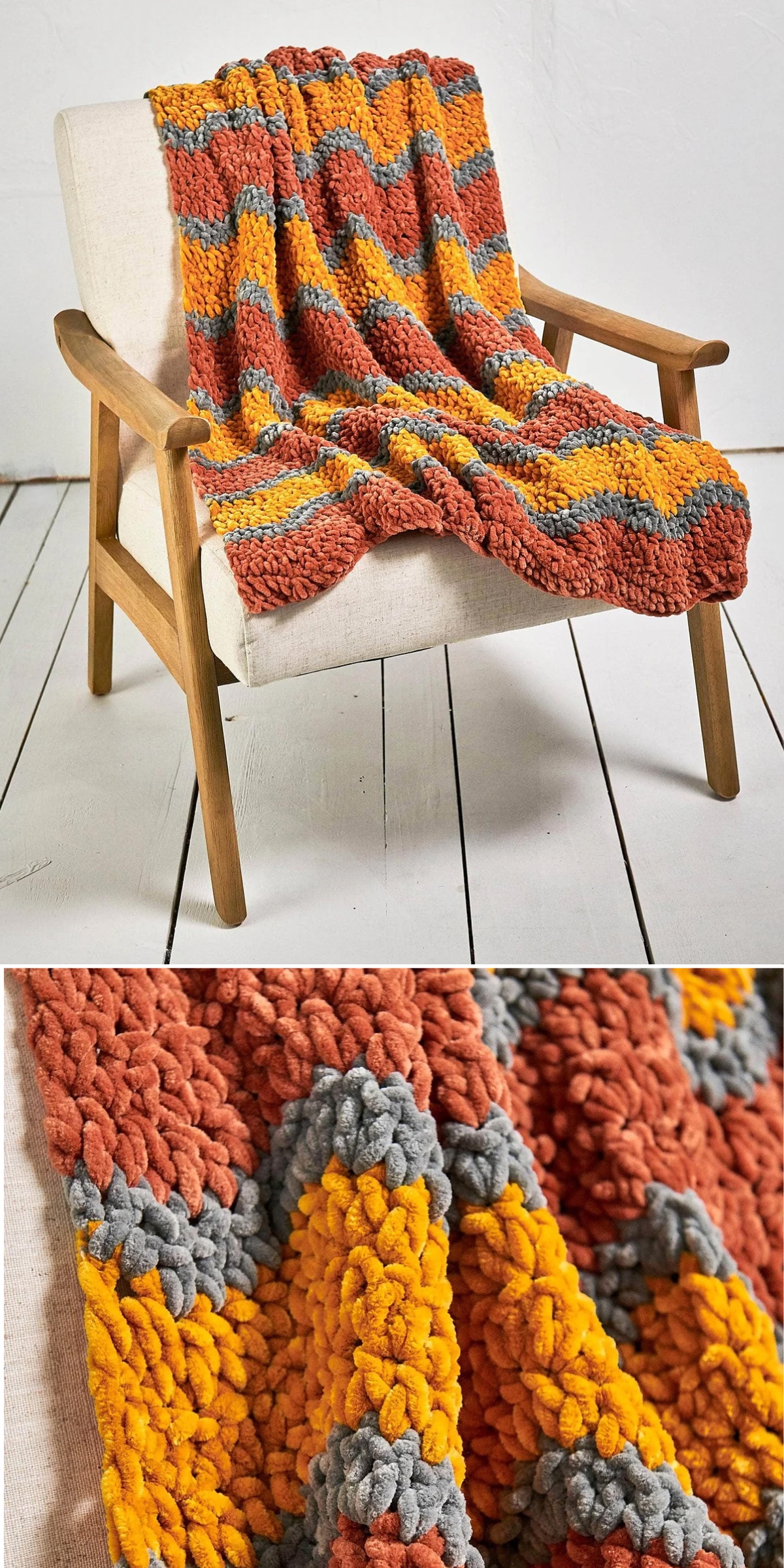 A cream-colored armchair with a plush crochet chunky blanket in orange, yellow, and gray zigzag stripes draped over it; close-up shows the blanket’s thick, soft texture.
