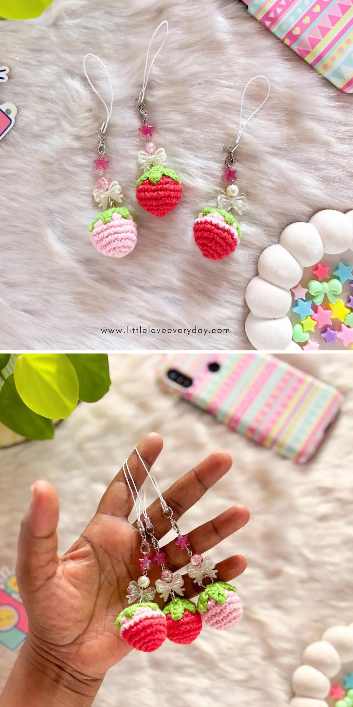 Three crochet strawberry keychains with green leaves and beaded loops are displayed on a furry surface and held in a hand, with colorful accessories in the background.