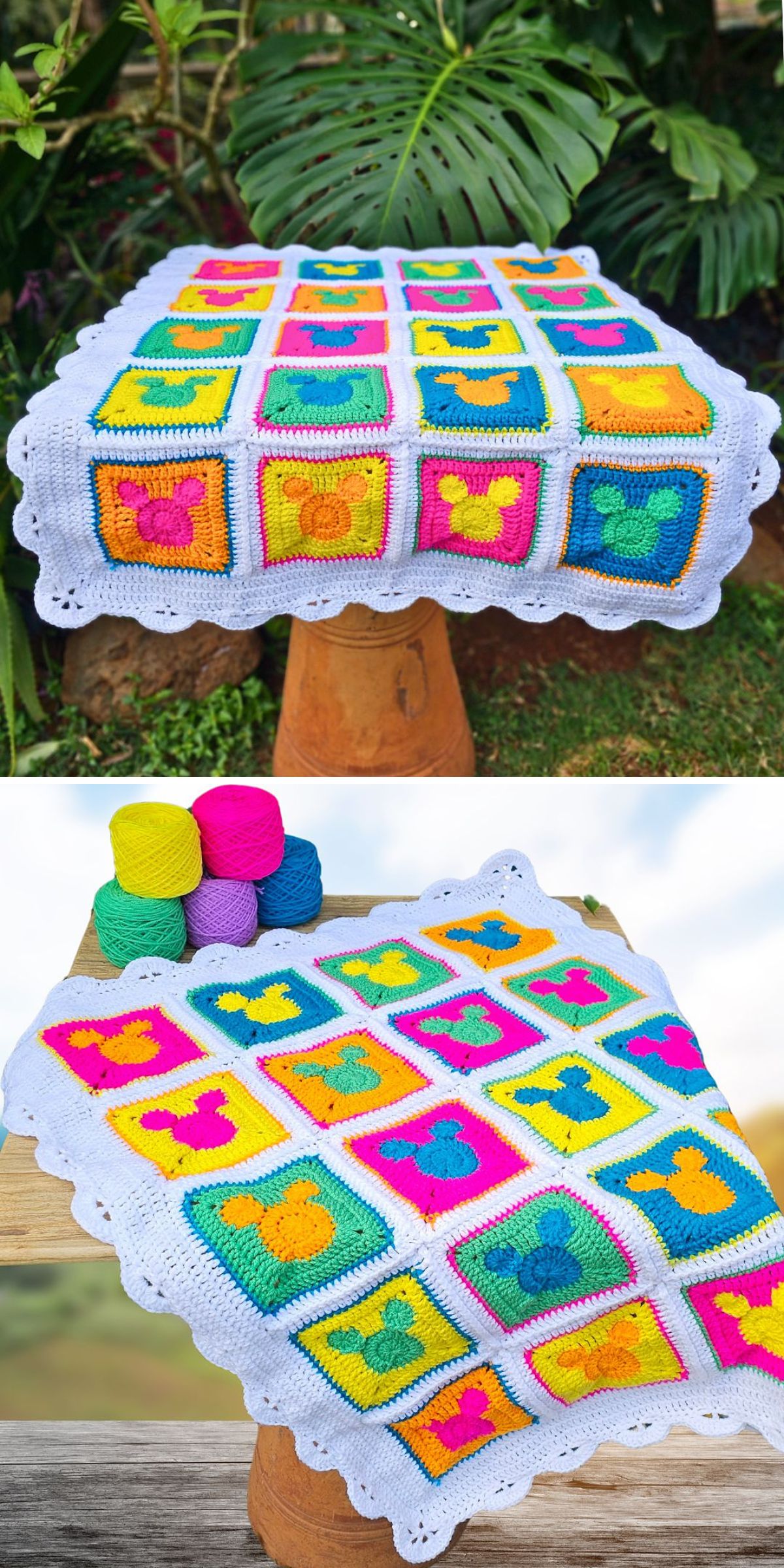 A colorful crocheted blanket featuring whimsical mouse motifs and a charming crochet animal square is draped over a stool, with four skeins of yarn in pink, yellow, green, and blue placed next to it. Lush plants are in the background.