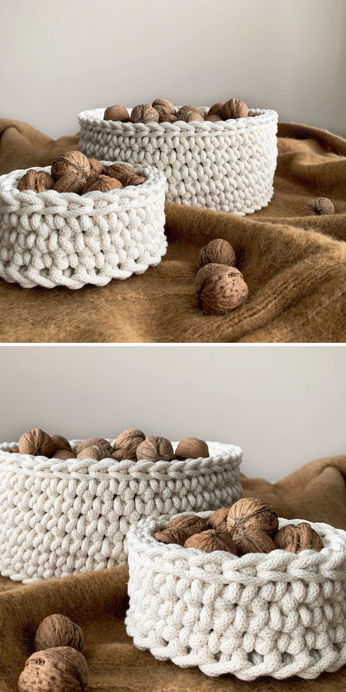 Two cream-colored crochet baskets filled with whole walnuts sit on a brown fabric surface, with extra walnuts scattered around.