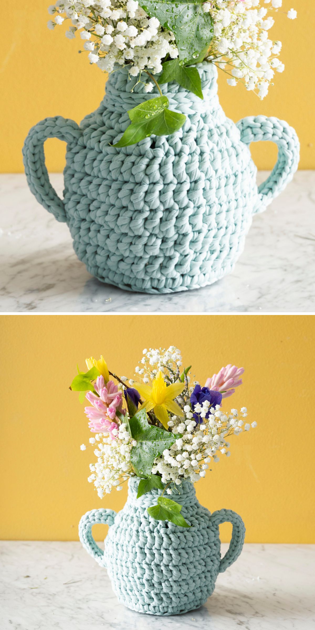 A blue, hand-crocheted vase with two handles, reminiscent of a charming crochet cozy, holds an arrangement of colorful flowers and greenery, set against a yellow background.