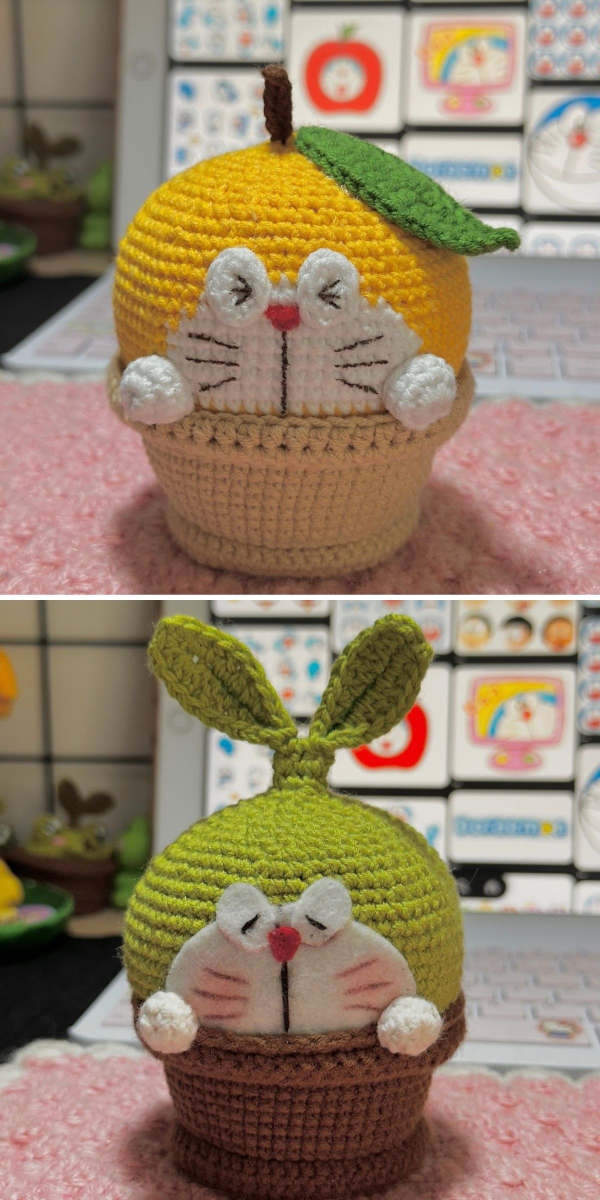 Two crocheted animal figures: one shaped like a citrus fruit with a leaf, the other green with rabbit ears and a leaf, both with pink cheeks and resembling an adorable crochet plant, sitting on a table in front of a laptop.