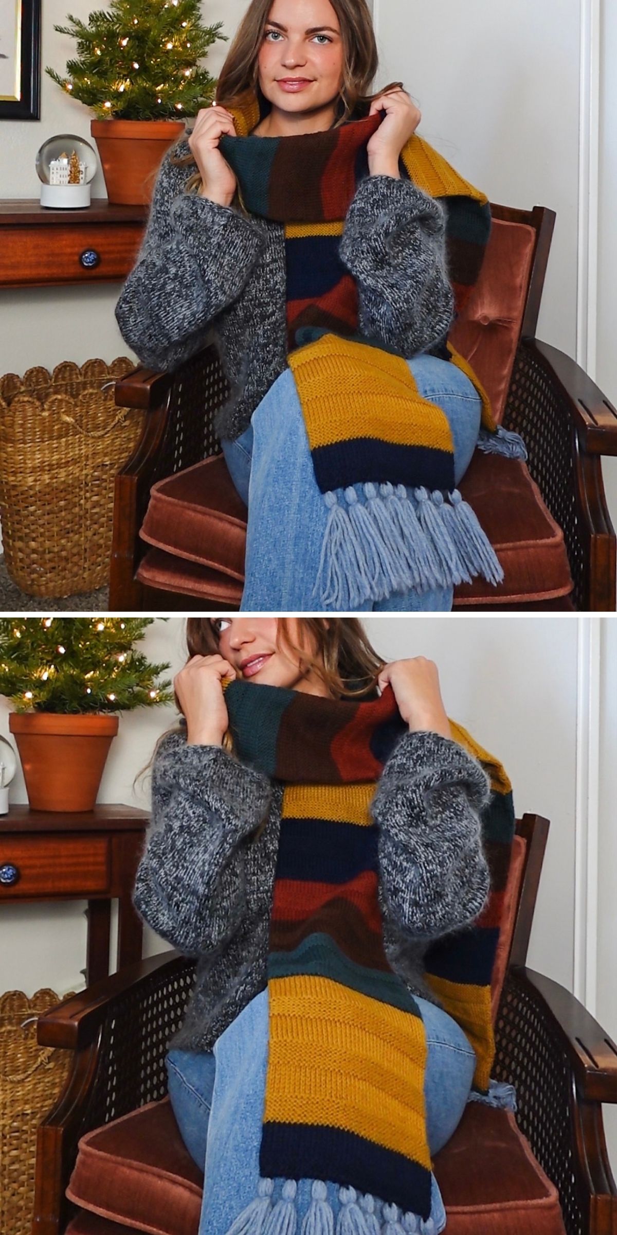 A person wearing a gray sweater, blue jeans, and a multicolored striped scarf — showcasing one of the latest knit scarf patterns — sits on a brown chair near a small table and Christmas tree.