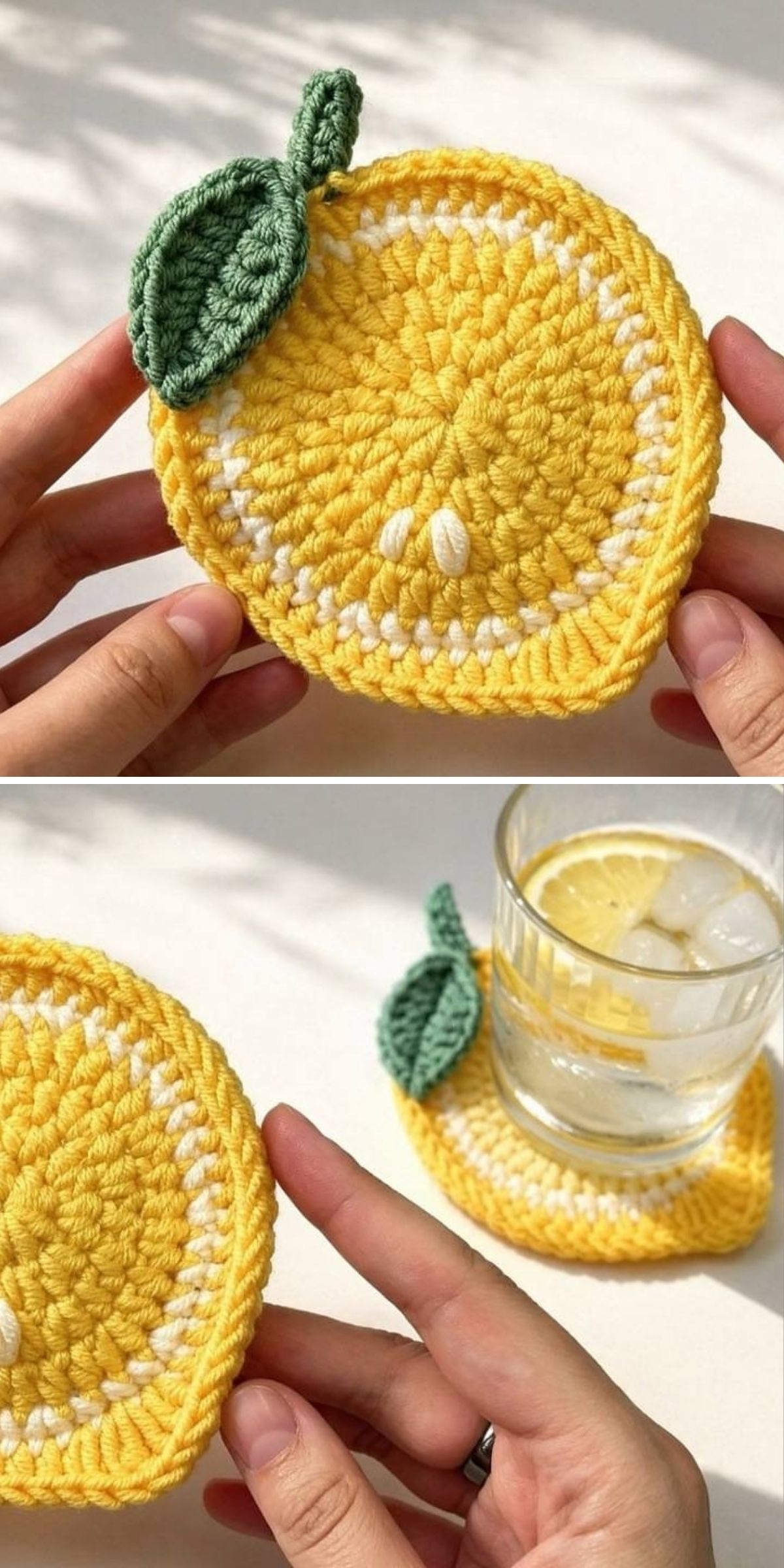 A crochet lemon slice coaster with a green leaf is shown held in hand and used under a glass of ice water with a lemon slice.
