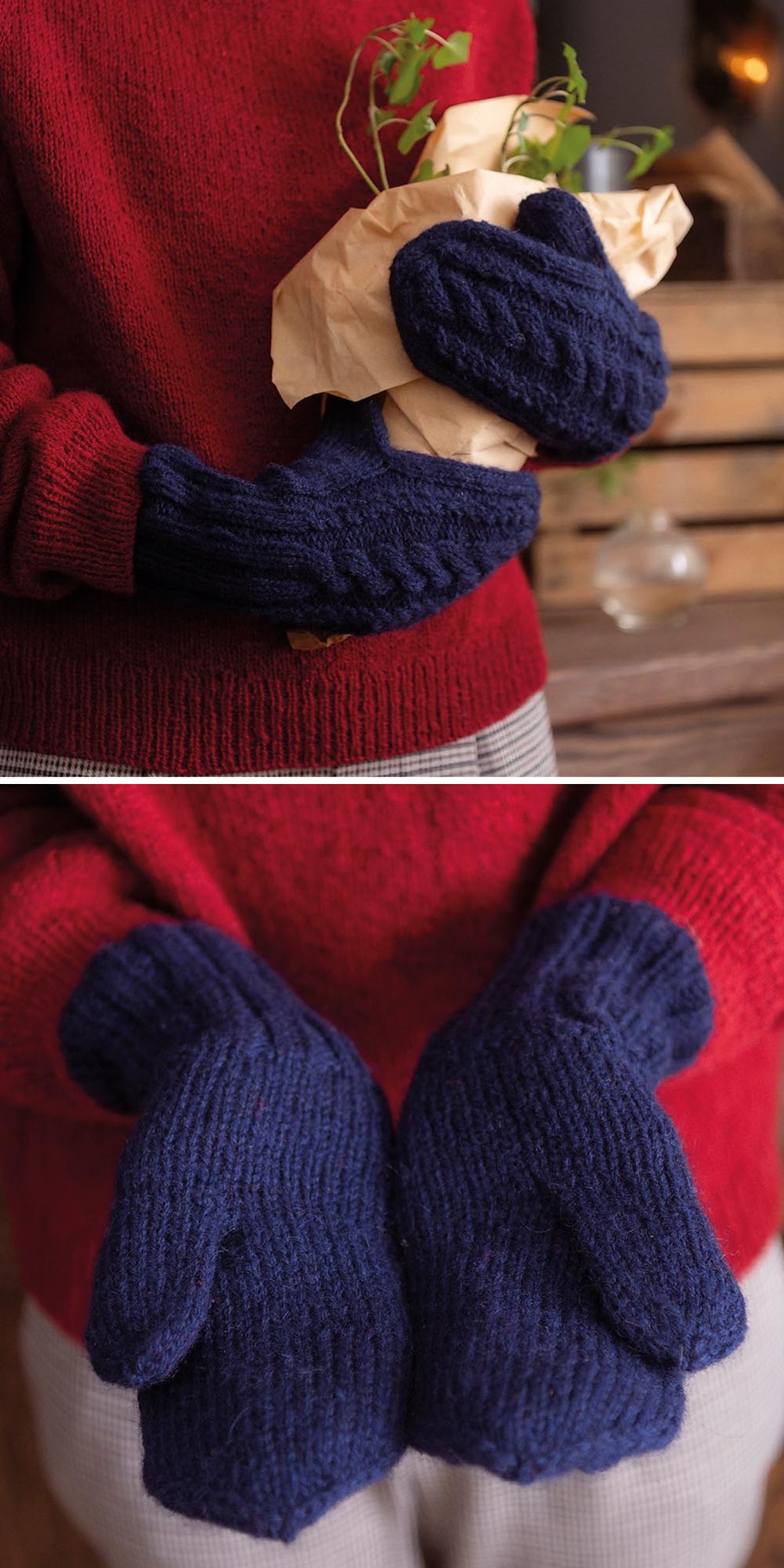 A person wearing a red sweater and blue knitted mitten holds a small plant wrapped in paper and shows the palms of the mittens.