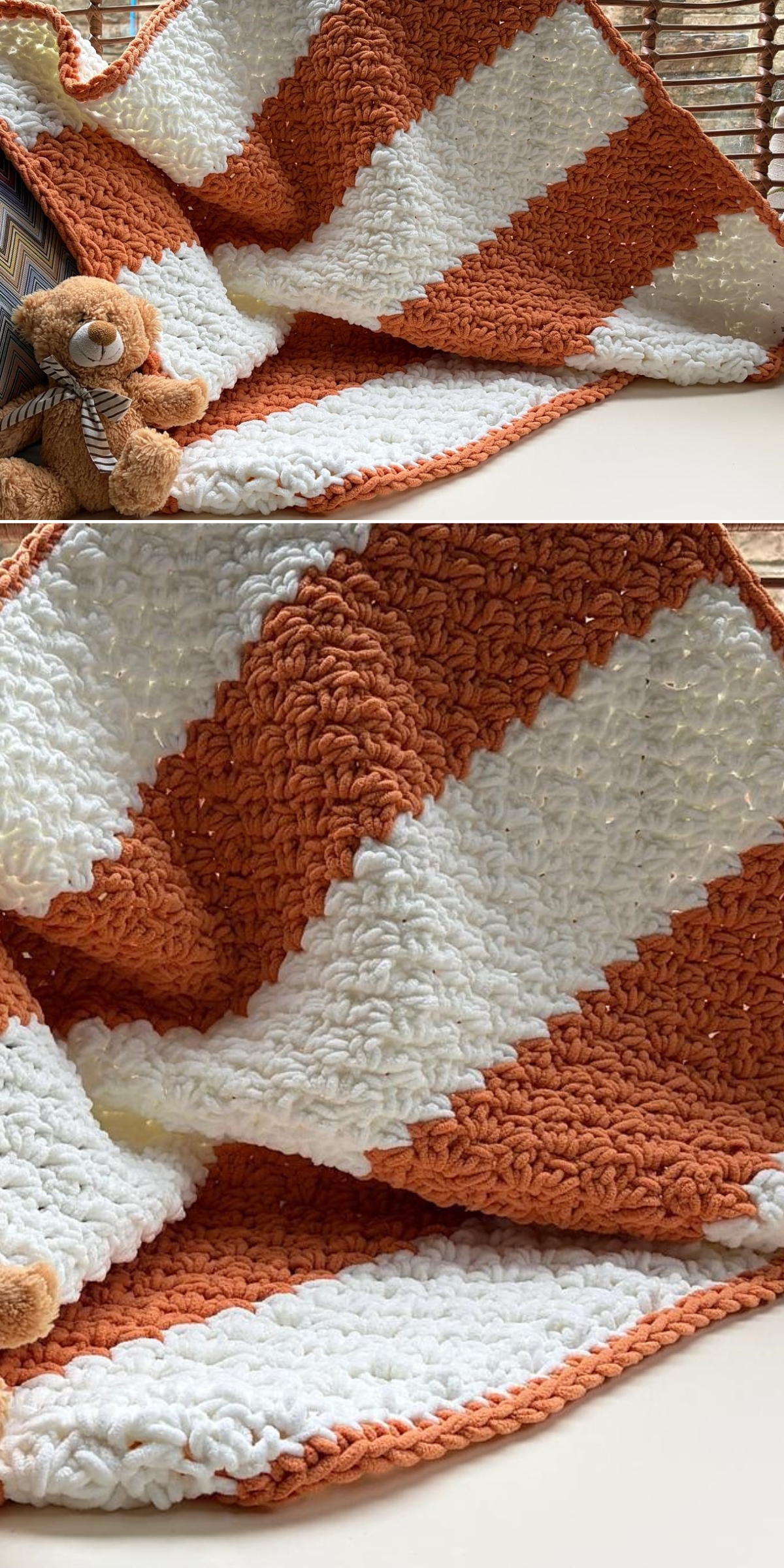 A crochet chunky blanket with wide orange and white diagonal stripes is displayed, partially folded, with a small brown teddy bear nearby.