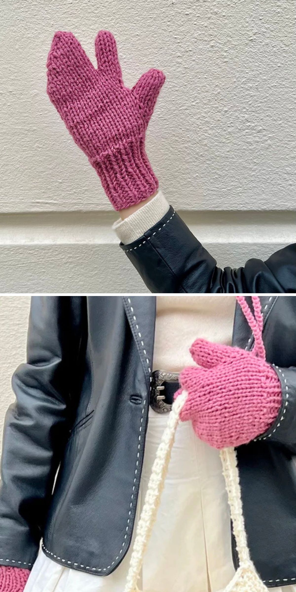 A person wears pink knitted mittens with a separate section for the index and middle fingers. The person is dressed in a black jacket and white skirt, holding a white bag. The cozy knitted mitten design adds both warmth and style to the outfit.