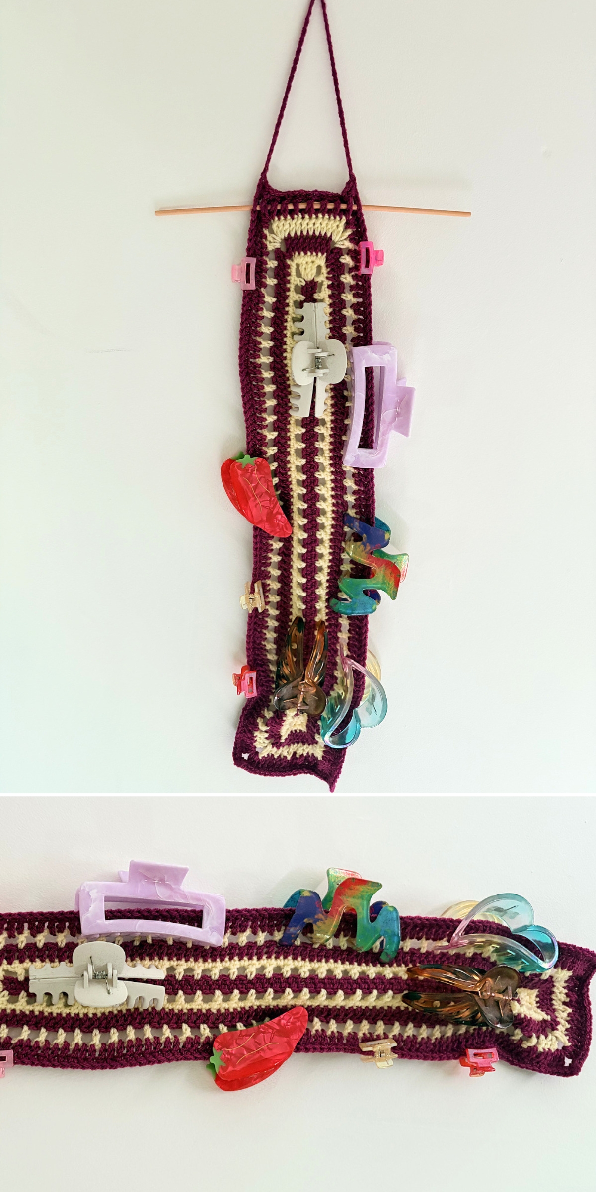 A crochet wall hanging organizer with colorful plastic clips and keychains hangs from a stick on a white wall.