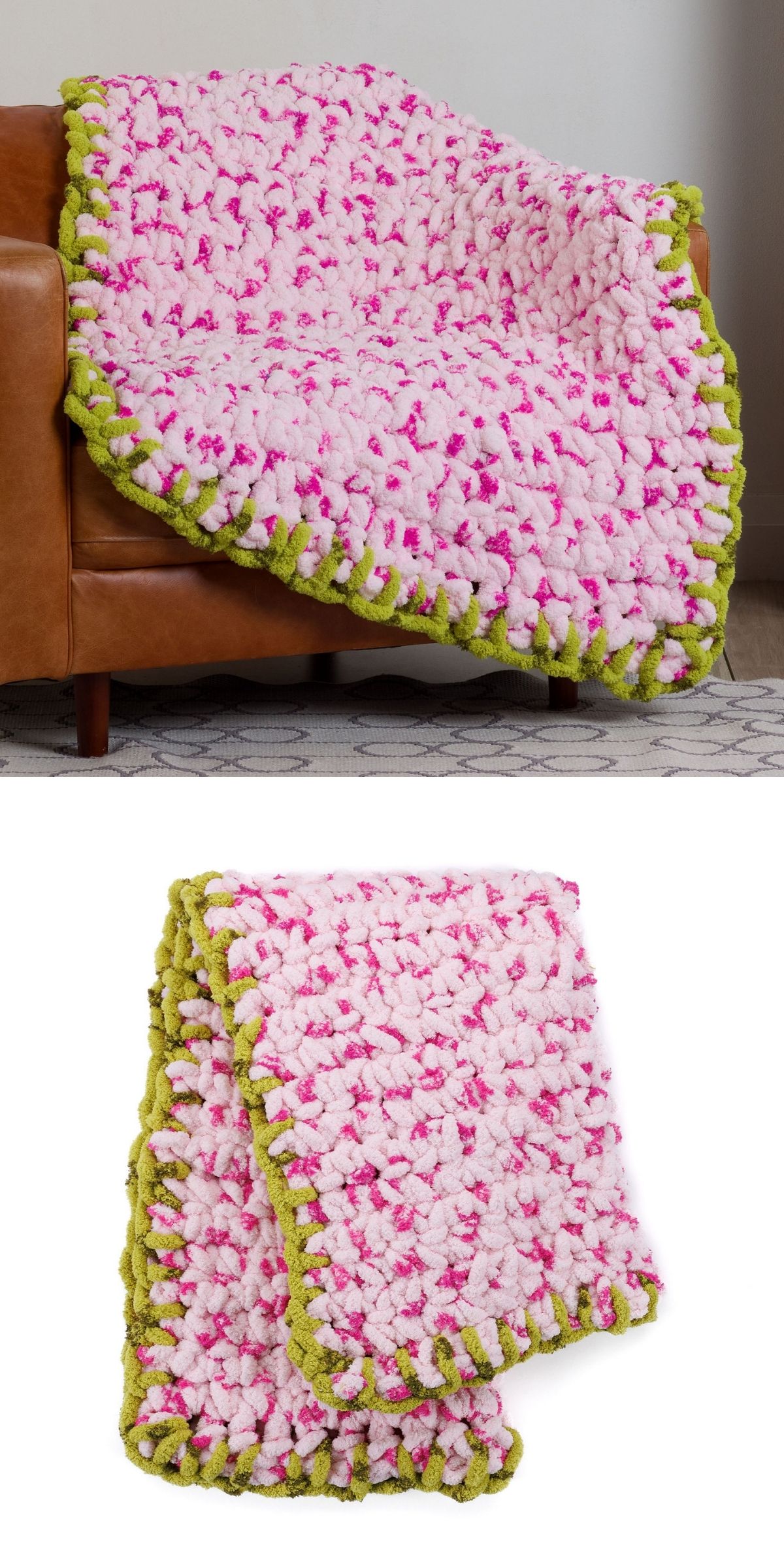 A crochet chunky blanket in pink and white with a green border, draped over a brown sofa and folded on a white background.