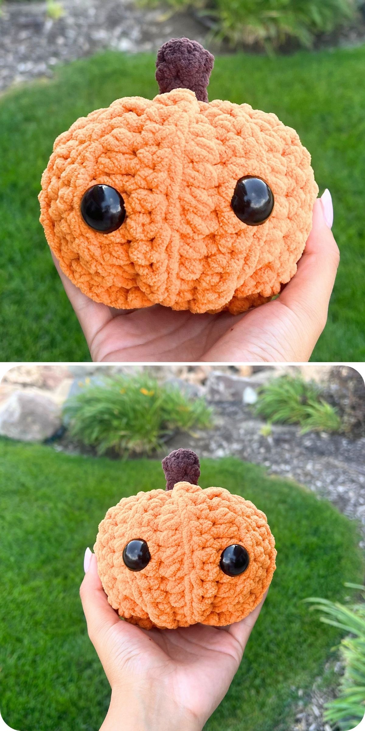 A hand holds a small, plush textured crochet pumpkin with black button eyes and a brown stem, against a grassy outdoor background.