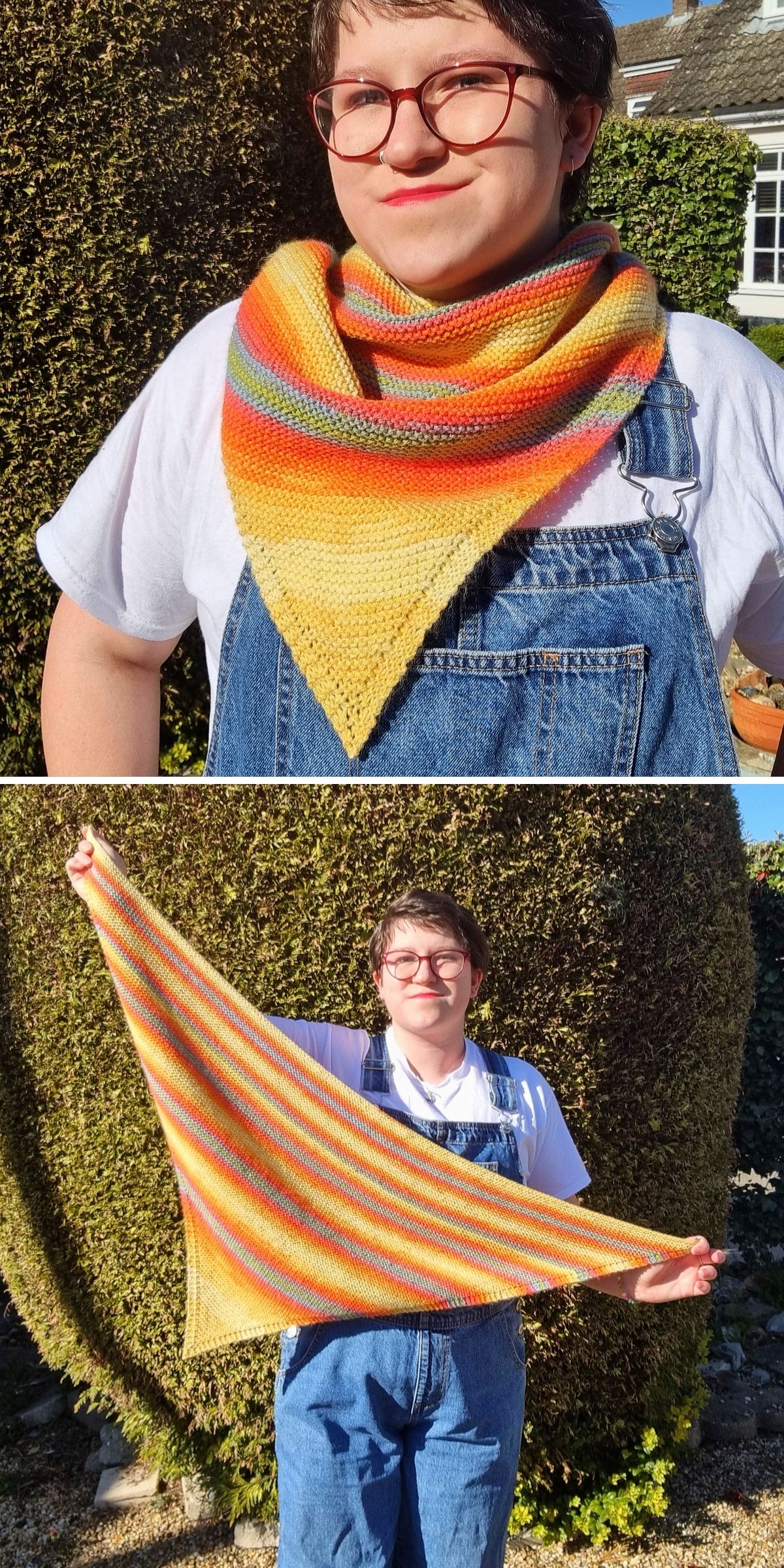 A person wearing a multi-colored knit shawl in a triangular shape featuring horizontal stripes in yellow, orange, and grey.