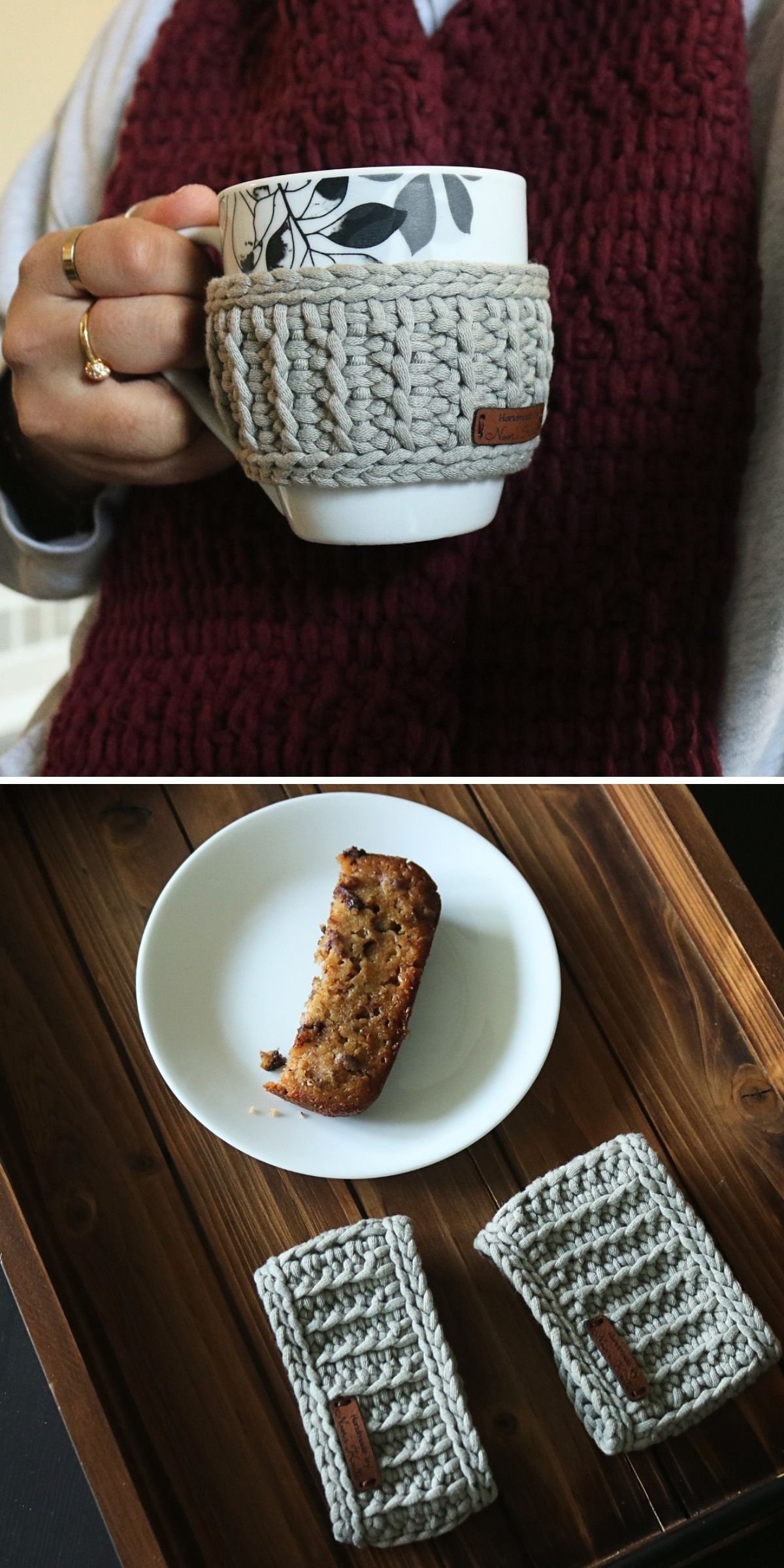 A person holds a mug wrapped in a gray crochet mug cozy; below is a plate with banana bread and two additional crocheted cozies on a wooden tray.