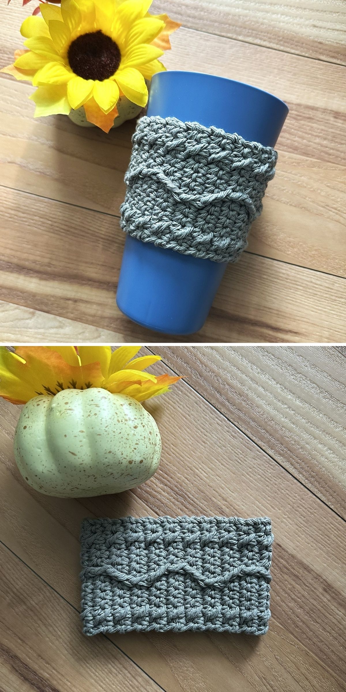 A gray crochet cup cozy with a wavy pattern is shown on a blue cup and laid flat on a wooden surface next to artificial sunflowers and a decorative gourd.
